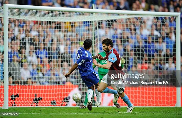 Carlos Cuellar of Aston Villa attempts to block the shot by Florent Malouda of Chelsea as he scores the second goal during the FA Cup sponsored by...
