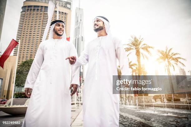 arabian men in the emirates - agal stock pictures, royalty-free photos & images