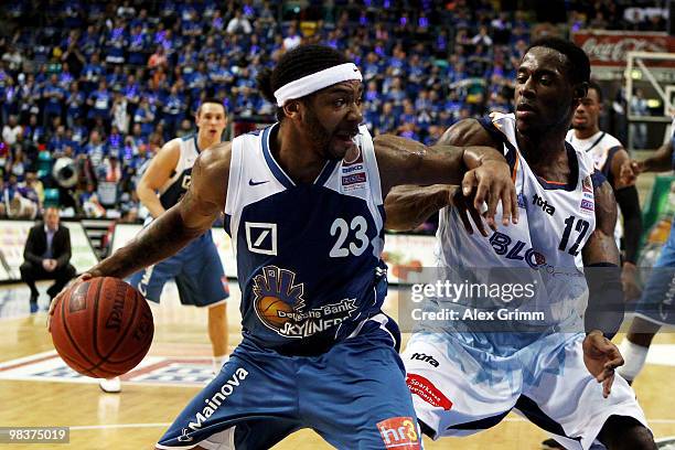 Quantez Robertson of Frankfurt is challenged by Torrell Martin of Bremerhaven during the semi final between Deutsche Bank Skyliners and Eisbaeren...