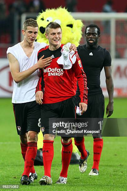 Lars Bender and Toni Kroos of Leverkusen celebrate the 1-1 draw after the Bundesliga match between Bayer Leverkusen and FC Bayern Muenchen at the...