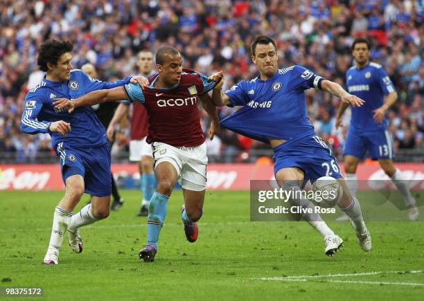 Gabriel Agbonlahor of Aston Villa pulls the shirt of John Terry of Chelsea as he is closed down by Yuri Zhirkov during the FA Cup sponsored by E.ON...