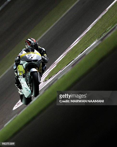 Japan's Hiroshi Aoyama of Interwetten Honda Team races during the 2010 MotoGP free practice at the Losail International Circuit in Doha on April 10,...