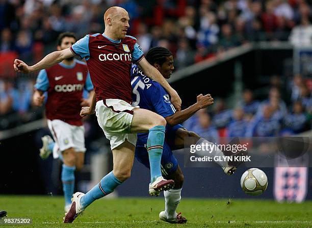 Aston Villa's Welsh defender James Collins vies with Chelsea's French midfielder Florent Malouda during the FA Cup semi-final football match at...