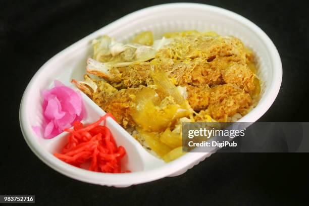 kamakura don bento in white disposable plastic box on black background - disposal container stock pictures, royalty-free photos & images