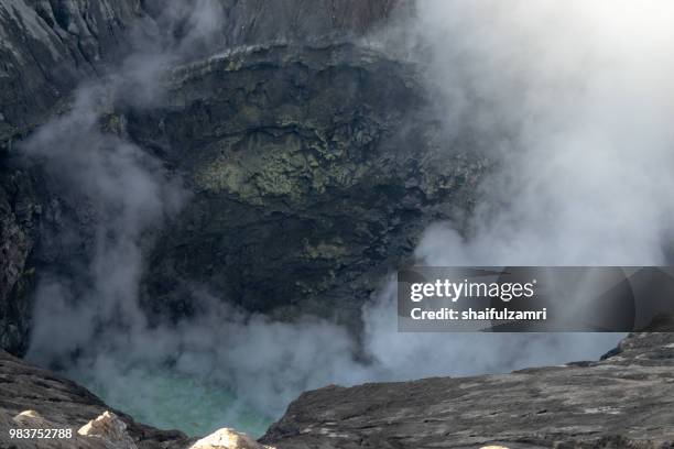 inside view of bromo's active crater. mount bromo (2,329 meters) is an active volcano and part of the tengger massif, in east java, indonesia. - shaifulzamri stock pictures, royalty-free photos & images