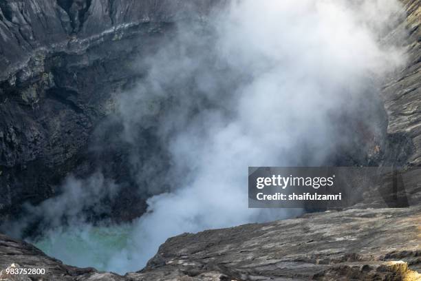 inside view of bromo's active crater. mount bromo (2,329 meters) is an active volcano and part of the tengger massif, in east java, indonesia. - shaifulzamri bildbanksfoton och bilder