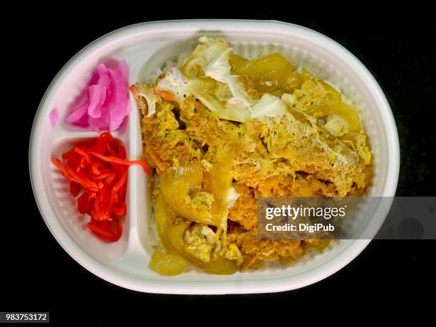 kamakura don bento in white disposable plastic box on black background - disposal container stock pictures, royalty-free photos & images