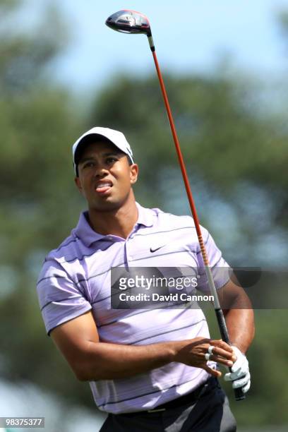 Tiger Woods watches his tee shot on the first hole during the third round of the 2010 Masters Tournament at Augusta National Golf Club on April 10,...