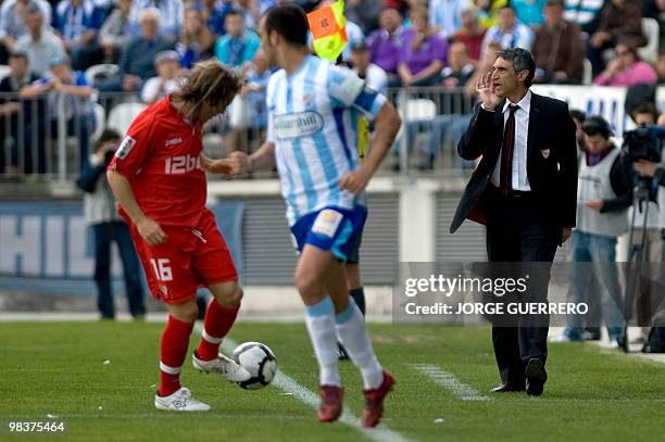 Sevilla's coach Antonio Alvarez gestures during a Spanish league football match against Malaga at the Rosaleda stadium in Malaga on April 10, 2010....