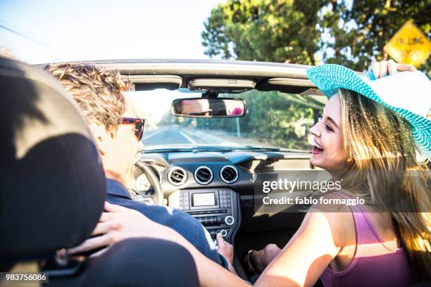 Couple On Convertible Car High-Res Stock Photo