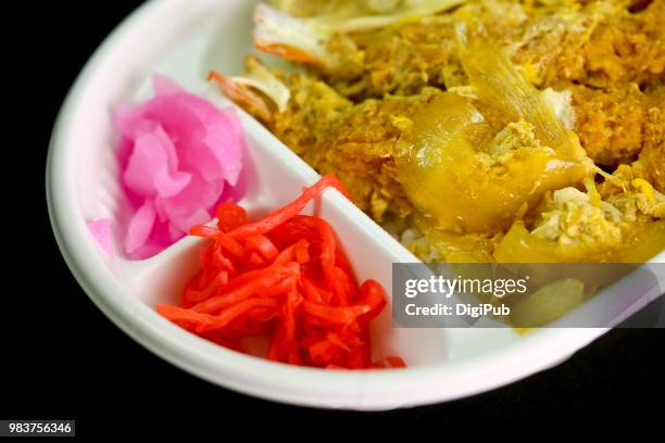kamakura don bento in white disposable plastic box on black background - disposal container stock pictures, royalty-free photos & images