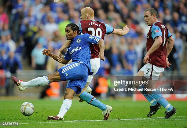 Florent Malouda of Chelsea of tackled by James Collins of Aston Villa as Richard Dunne looks on during the FA Cup sponsored by E.ON Semi Final match...