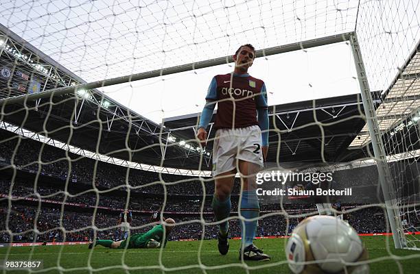 Luke Young of Aston Villa is dejected as he goes to pick the ball out of the net during the FA Cup sponsored by E.ON Semi Final match between Aston...