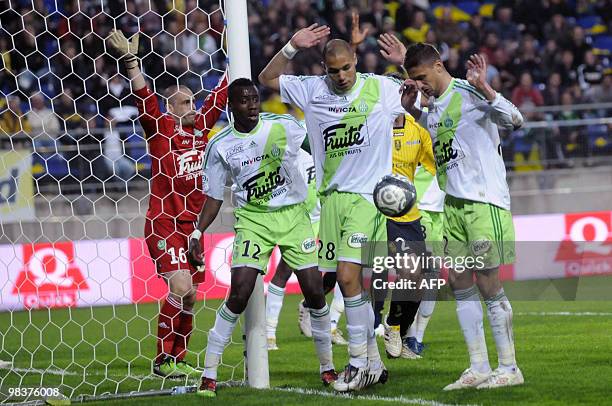 Saint Etienne's midfielder Blaise Matuidi, defender Yohan Benalouane and defender Cédric Varrault look at the ball during the French L1 football...