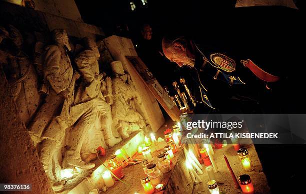 Hungarian lights a candle at the statue of the legendary Polish general of Hungarian revolution in 1848-1849, Jeseph Bem, at the Bem square of the...