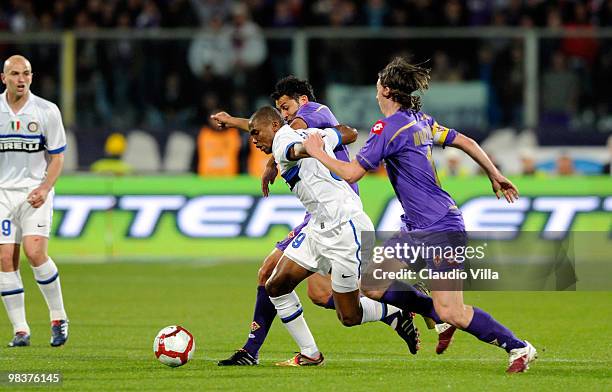 Riccardo Montolivo of ACF Fiorentina competes for the ball with Samuel Eto'o of FC Internazionale Milano during the Serie A match between ACF...