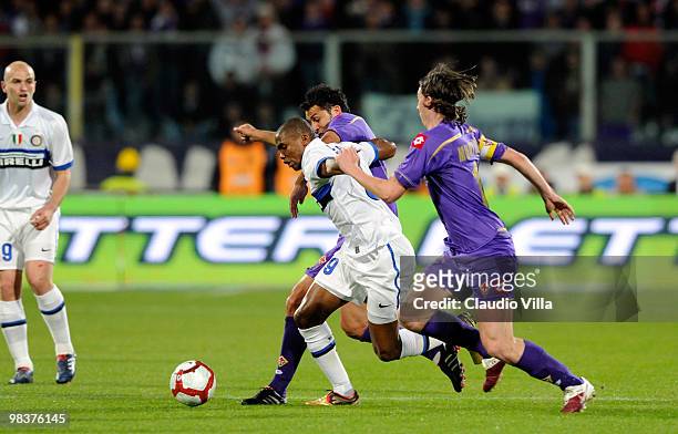 Riccardo Montolivo of ACF Fiorentina competes for the ball with Samuel Eto'o of FC Internazionale Milano during the Serie A match between ACF...