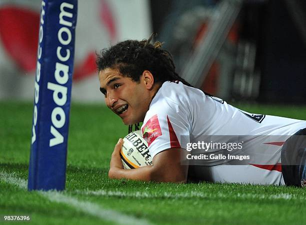 Saia Faingaa of the Reds scores his try during the Super 14 match between Lions and Reds from Coca Cola Park Stadium on April 10, 2010 in...