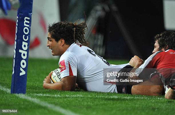 Saia Faingaa of the Reds scores his try during the Super 14 match between Lions and Reds from Coca Cola Park Stadium on April 10, 2010 in...