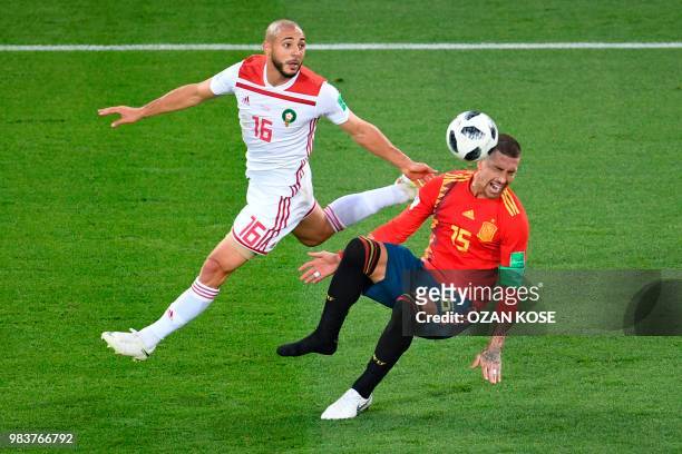 Morocco's forward Noureddine Amrabat vies with Spain's defender Sergio Ramos during the Russia 2018 World Cup Group B football match between Spain...