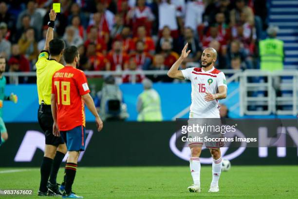 Nordin Amrabat of Morocco receives a yellow card from referee Ravshan Irmatov during the World Cup match between Spain v Morocco at the Kaliningrad...