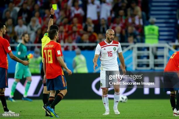 Nordin Amrabat of Morocco receives a yellow card from referee Ravshan Irmatov during the World Cup match between Spain v Morocco at the Kaliningrad...