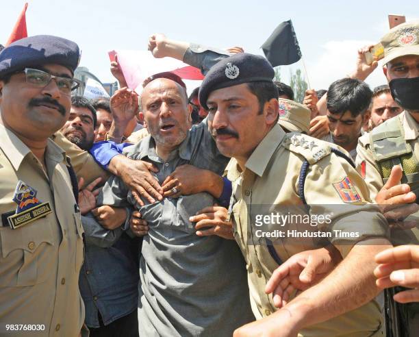 Independent MLA Sheikh Abdul Rashid along with his supporters shouts slogans during a protest against the recent deaths and against Bharatiya Janata...
