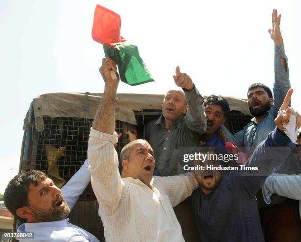 Independent MLA Sheikh Abdul Rashid along with his supporters shout slogans inside a police vehicle after being detained during a protest against the...