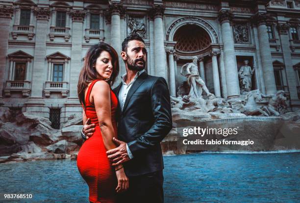 couple in rome - coin fountain stock pictures, royalty-free photos & images