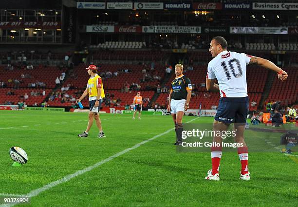 Quade Cooper of the Reds prepares to kick a conversion during the Super 14 match between Lions and Reds from Coca Cola Park Stadium on April 10, 2010...