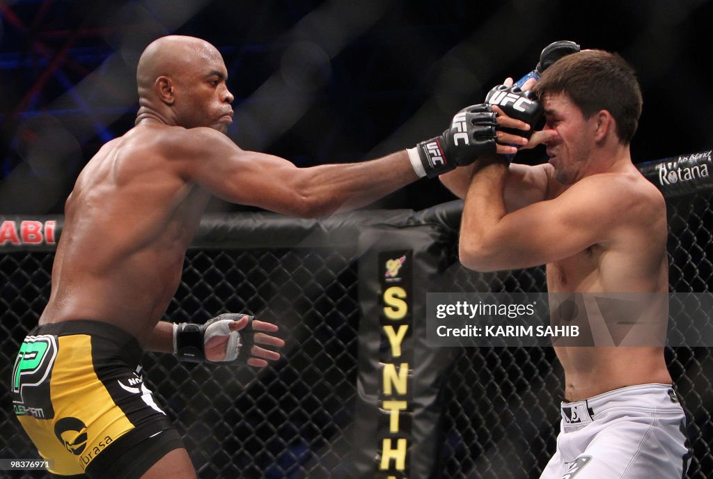 Brazil's Anderson Silva (L) attacks his