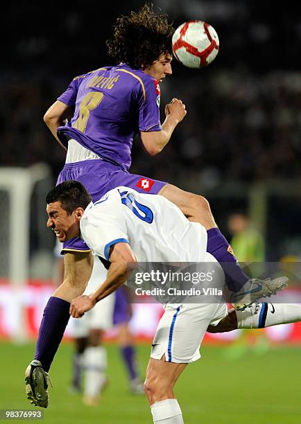 Stevan Jovetic of ACF Fiorentina competes for the ball with Lucio of FC Internazionale Milano during the Serie A match between ACF Fiorentina and FC...