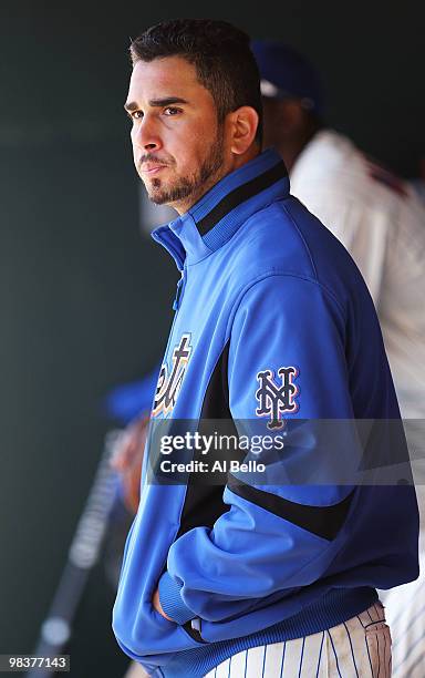 Oliver Perez of the New York Mets looks on in the dugout after being pulled in the fifth inning against the Washington Nationals during their game on...