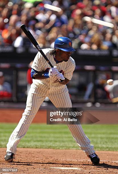 Jose Reyes of the New York Mets is hit by a pitch against the Washington Nationals during their game on April 10, 2010 at Citi Field in the Flushing...