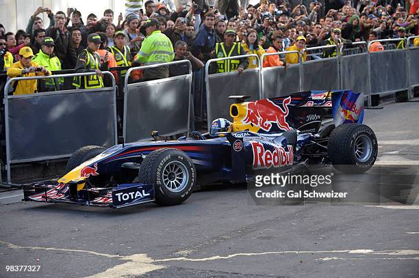 David Coulthard, former Scottish Formula One driver, drives a Red Bull Racing F1 vehicle during a display on a main street, close to Bolivar Square...