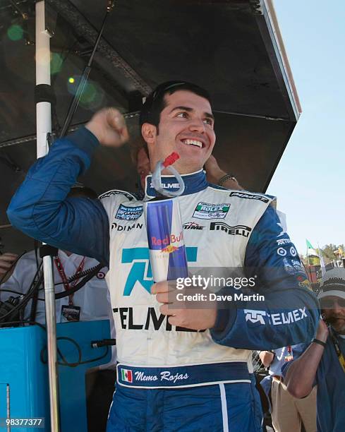 Memo Rojas, driver of the Chip Ganassi Racing BMW Riley pumps his fist as co-driver Scott Pruett takes the checkered flag during the Porsche 250 auto...