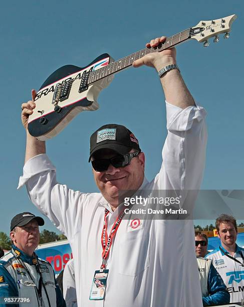 Chip Ganassi, owner of the Ganassi Racing BMW Riley celebrates in Victory Lane after his drivers Memo Rojas and Scott Pruett drove to a win in the...
