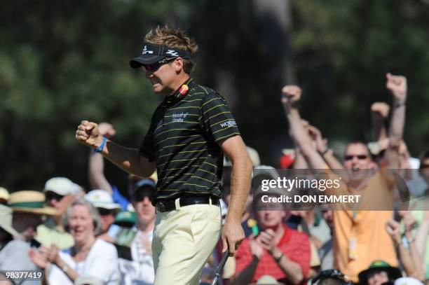 Ian Poulter of England sinks a long putt on the 7th hole during the 3rd round of the Masters Golf Tournament at Augusta National Golf Club on April...