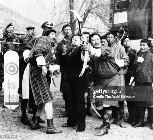 Prince Naruhito tries traditional archery at Rinpung Dzong on March 13, 1987 in Paro, Nepal.