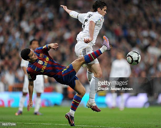 Pedro Rodriguez of FC Barcelona duels for the ball with Fernando Gago of Real Madrid during the La Liga match between Real Madrid and Barcelona at...