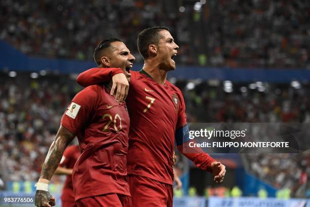 Portugal's forward Ricardo Quaresma celebrates scoring the opening goal with Portugal's forward Cristiano Ronaldo during the Russia 2018 World Cup...