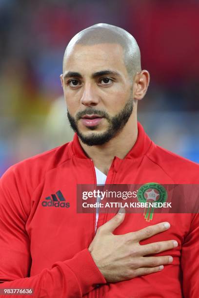 Morocco's forward Noureddine Amrabat listens to the national anthem before the Russia 2018 World Cup Group B football match between Spain and Morocco...