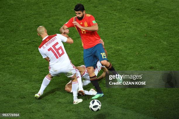 Morocco's forward Noureddine Amrabat vies with Spain's forward Diego Costa during the Russia 2018 World Cup Group B football match between Spain and...