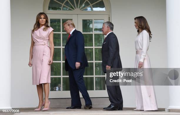 President Donald Trump and first lady Melania Trump greet King Abdullah II and Queen Rania of Jordan on their arrival at the South Portico of the...