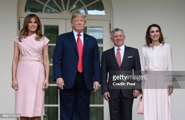 President Donald Trump and first lady Melania Trump greet King Abdullah II and Queen Rania of Jordan on their arrival at the South Portico of the...