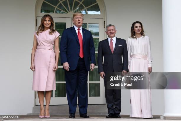 President Donald Trump and first lady Melania Trump greet King Abdullah II and Queen Rania of Jordan on their arrival at the South Portico of the...