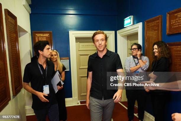 Damian Lewis walks to stage with Burton Chaikin, Kate Schellenbach, and Sheila Rogers during The Late Late Show with James Corden in London, airing...