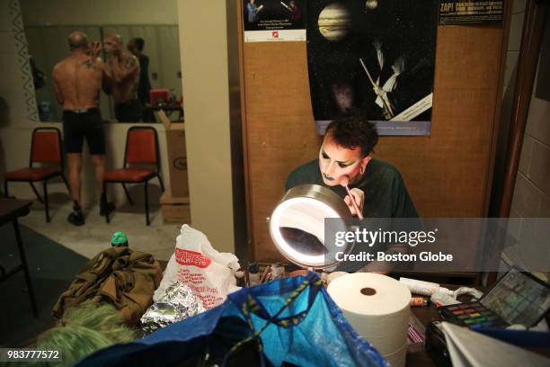 Violencia Exclamation Point, front, and Pristine Christine, rear, apply makeup before performing in a drag show at the Museum of Science in Boston on...