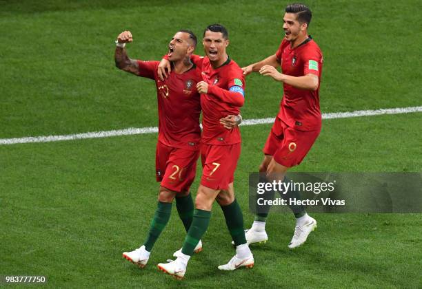Ricardo Quaresma of Portugal celebrates with teammates Cristiano Ronaldo and Andre Silva after scoring his team's first goal during the 2018 FIFA...