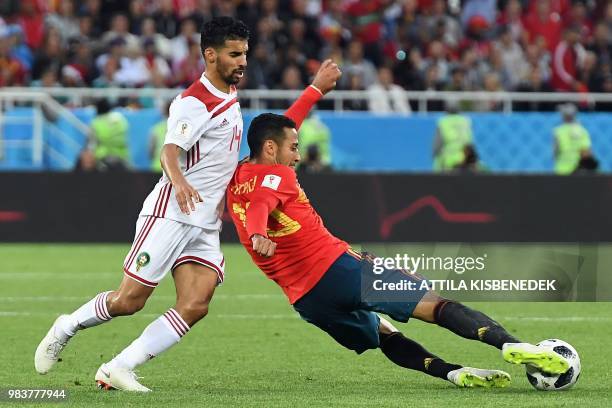 Morocco's midfielder Mbarek Boussoufa vies with Spain's midfielder Thiago Alcantara during the Russia 2018 World Cup Group B football match between...